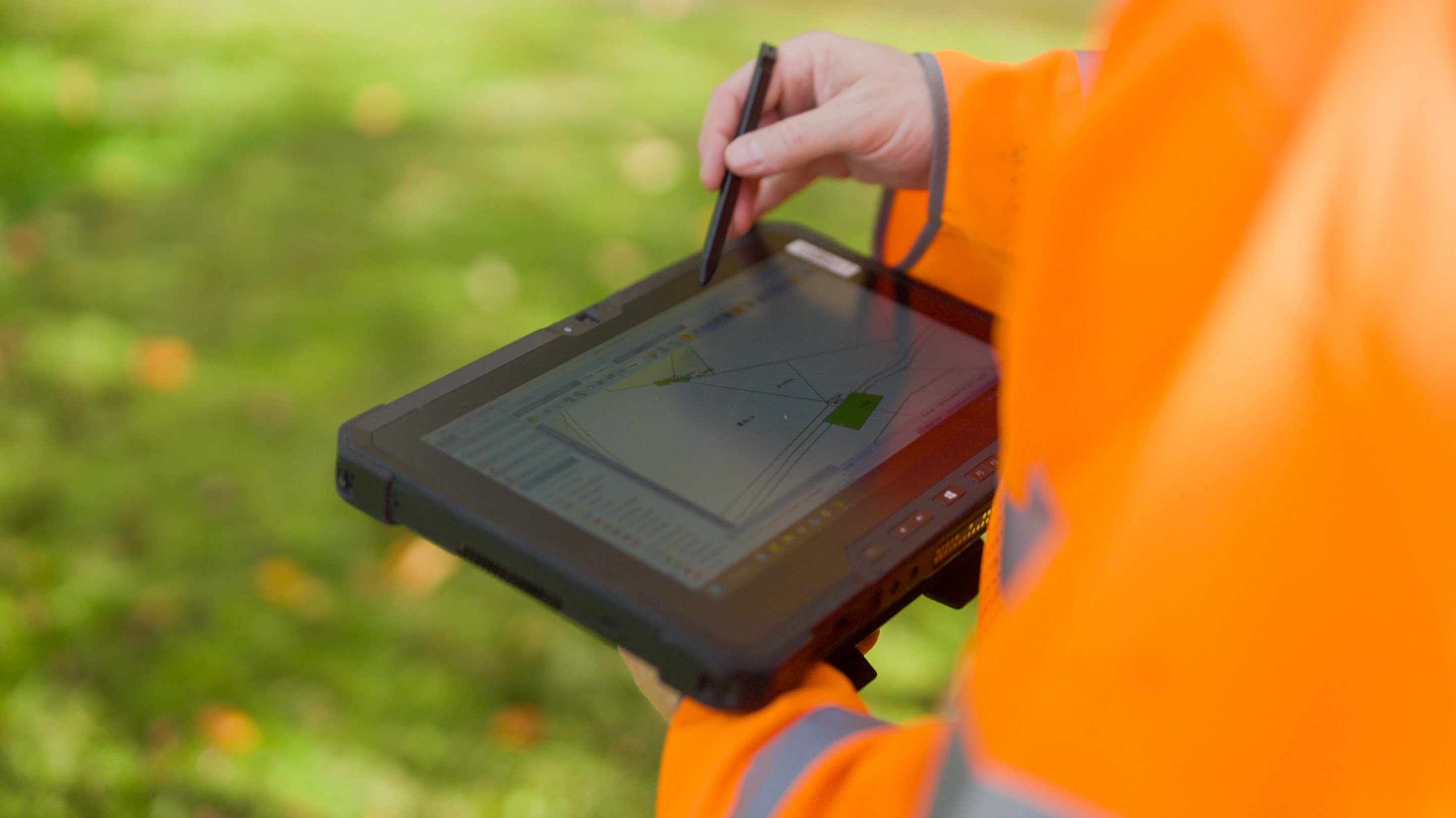 UA-5 surveyor using digital tablet in the field